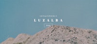 an image of a mountain with the words luzalba on it